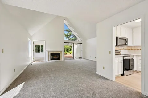 a kitchen with stainless steel appliances granite countertop a sink and a stove