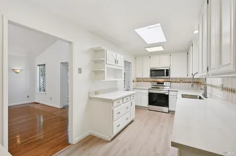 a kitchen with a sink and cabinets