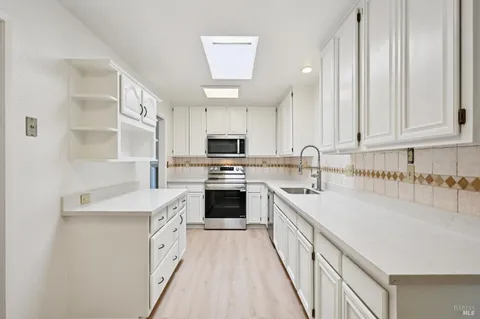 a view of kitchen with wooden floor