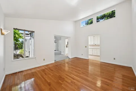a bathroom with a sink a toilet and a large mirror