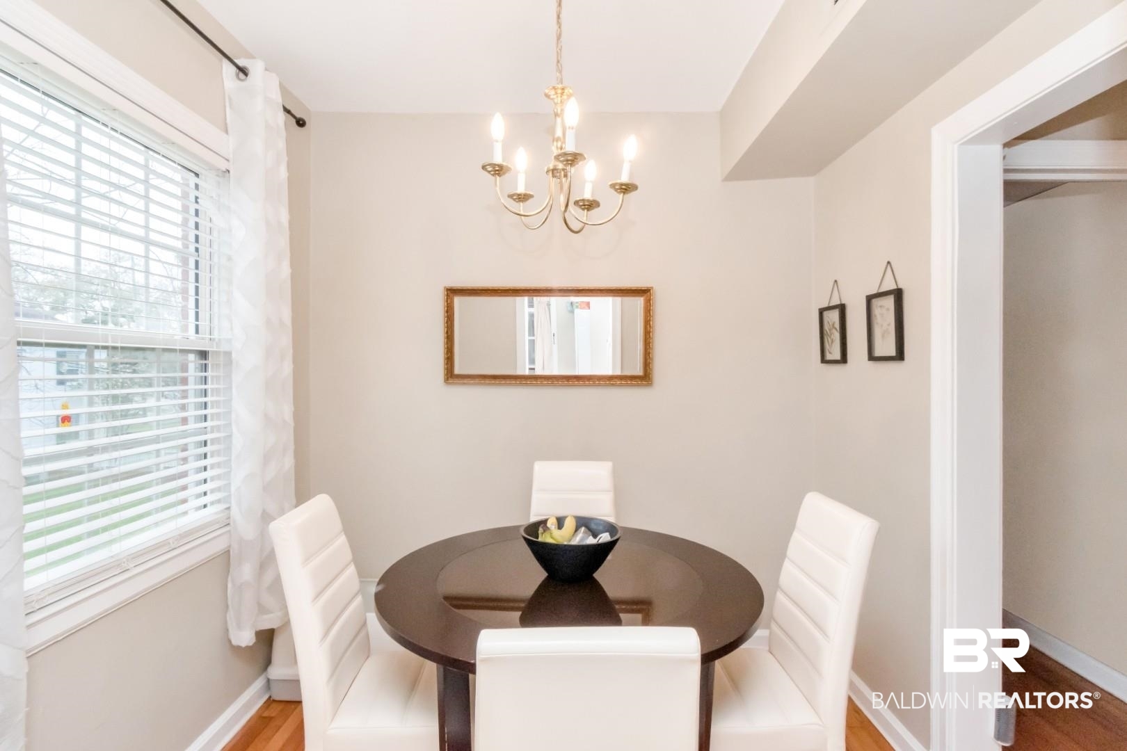 214 Upham Street, Unit 17C Mobile, AL 36607 - Photo 19 of 32 Dining area with wood finished floors and hanging lights