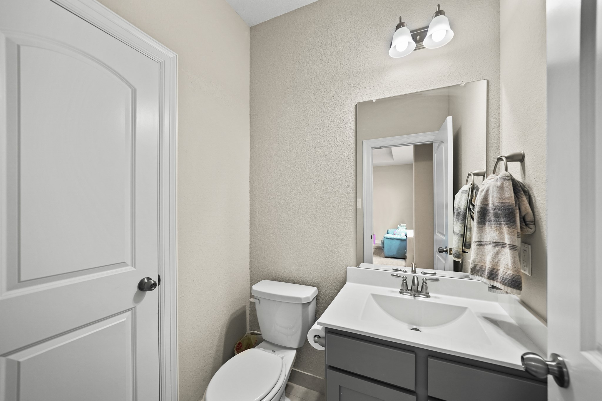 24031 Corinaldo Court Katy, TX 77493 - Photo 15 of 23 a bathroom with a sink toilet and mirror