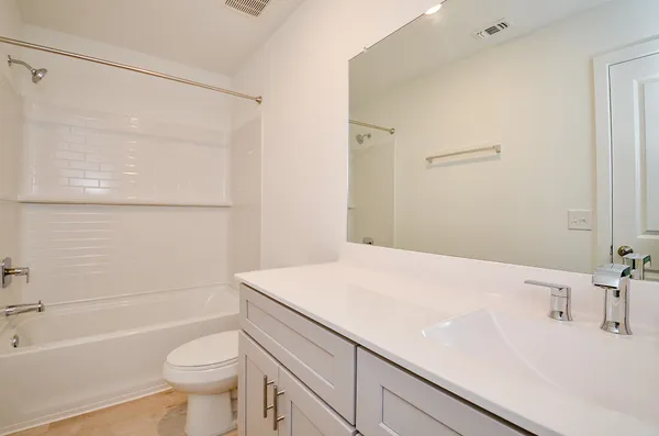 a bathroom with a sink a toilet and a bathtub