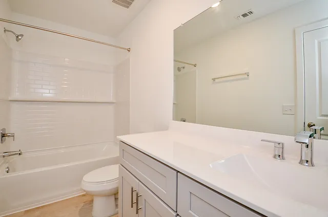 a bathroom with a sink a toilet and a bathtub