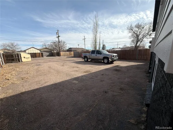 a view of a car park in front of house