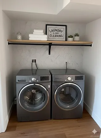 a view of washer and dryer in a utility room