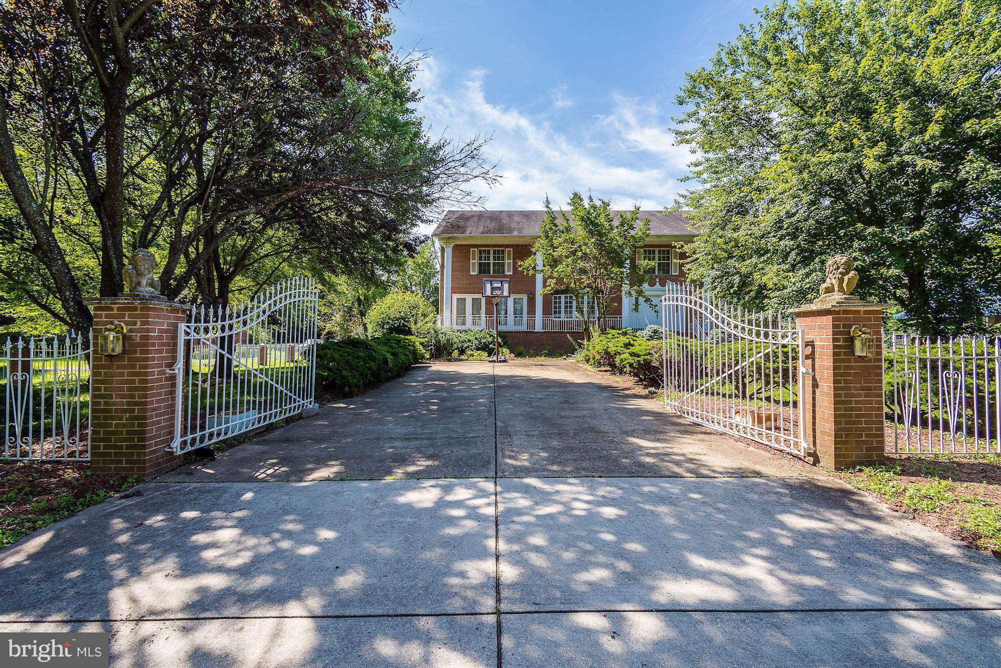 6413 Horseshoe Road Clinton, MD 20735 - Photo 1 of 30 Grand entrance home with this gated driveway.