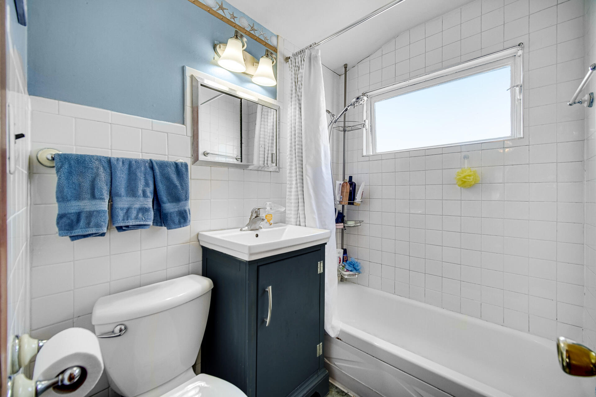 9503 Forrest Drive Highland, IN 46322 - Photo 11 of 19 a bathroom with a sink a toilet and shower