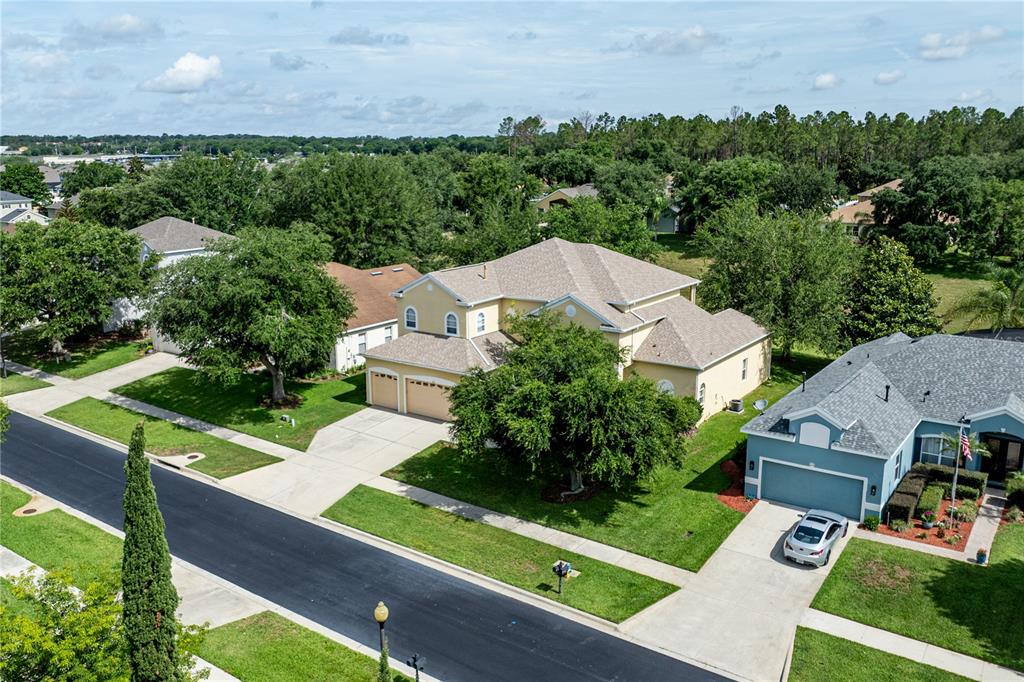 2718 Knightsbridge Road Clermont, FL 34711 - Photo 64 of 72 an aerial view of a house with a garden