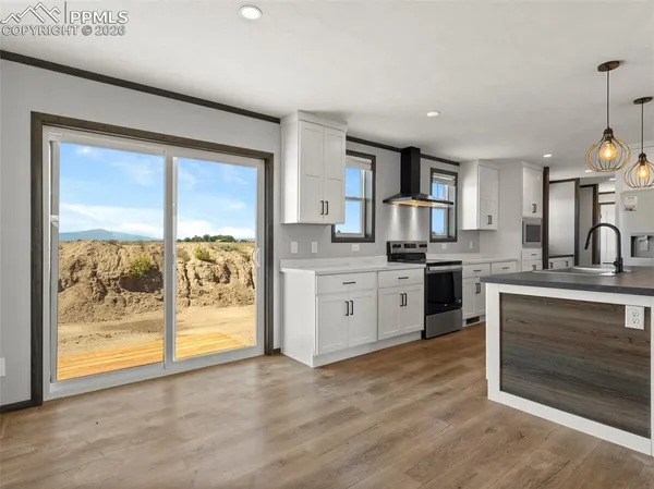 a kitchen with a sink stainless steel appliances and cabinets