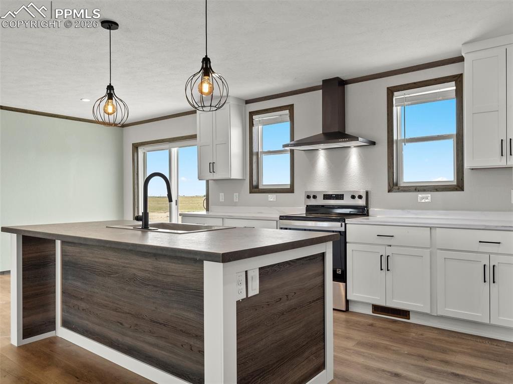 2820 East Ellicott Road South Calhan, CO 80808 - Photo 13 of 39 a kitchen with a stove and a sink