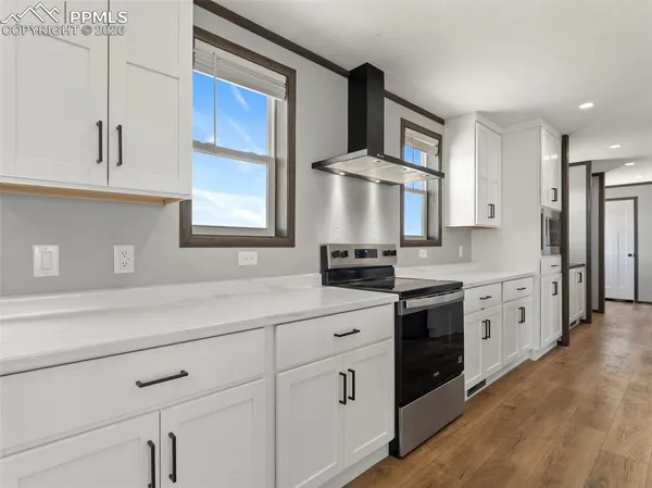 a spacious bathroom with a double vanity sink mirror and double