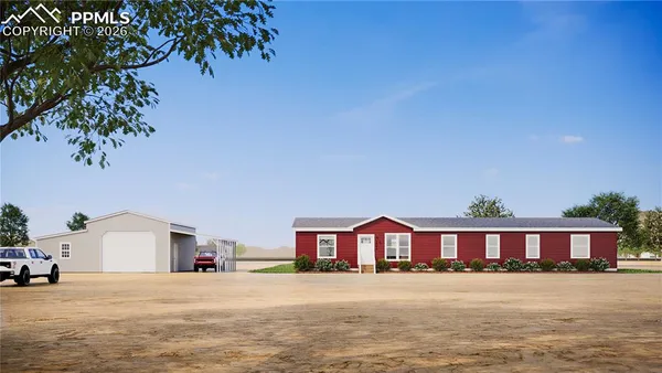 a view of a house with a yard and large tree