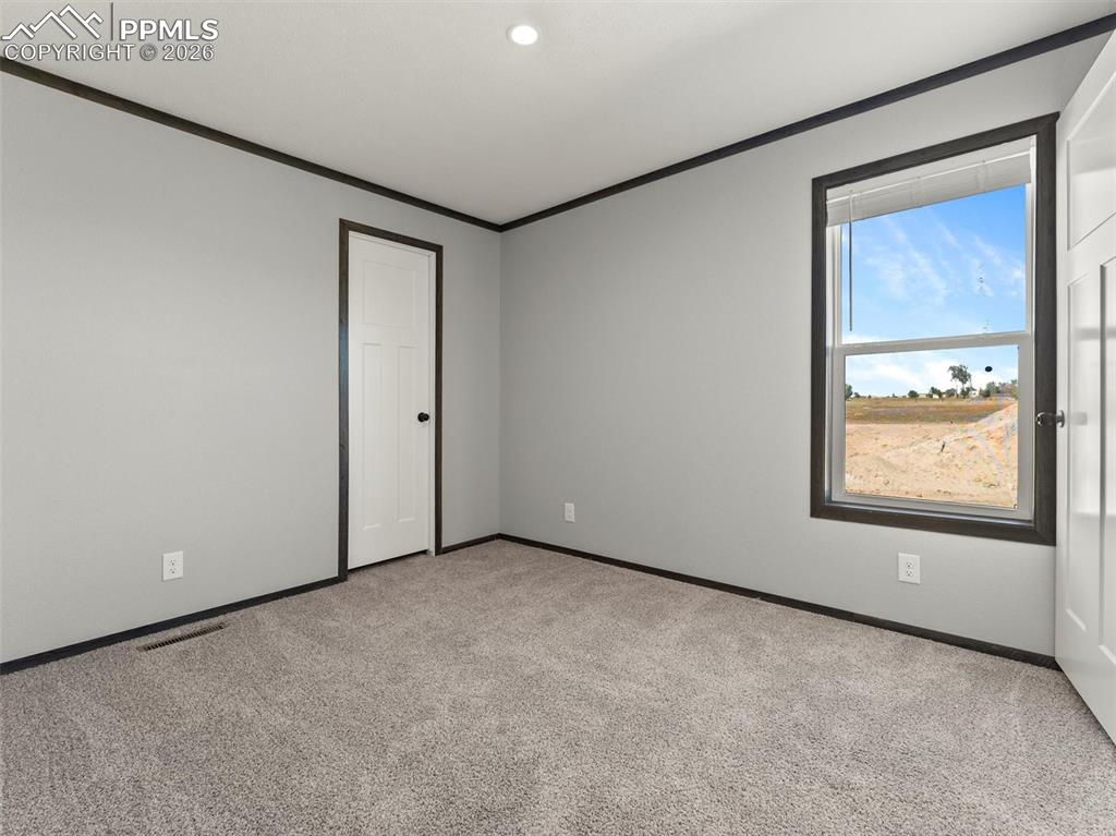 2820 East Ellicott Road South Calhan, CO 80808 - Photo 31 of 39 an empty room with windows