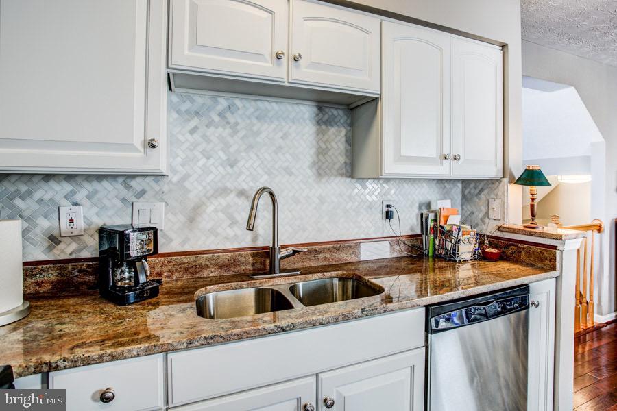 5036 Finsbury Road Baltimore, MD 21237 - Photo 13 of 34 a kitchen with sink cabinets and appliances