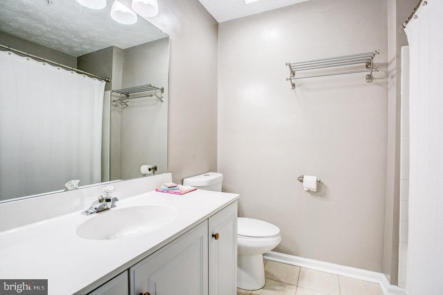 5036 Finsbury Road Baltimore, MD 21237 - Photo 17 of 34 a bathroom with a sink toilet and shower