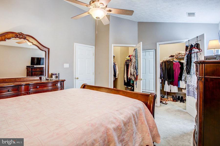 5036 Finsbury Road Baltimore, MD 21237 - Photo 18 of 34 a bed room with a bed and a mirror