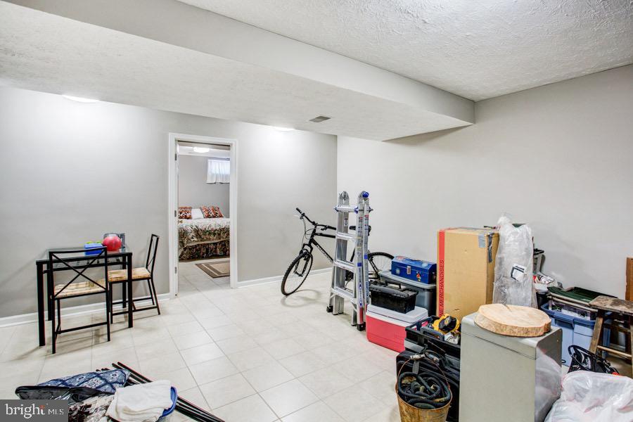 5036 Finsbury Road Baltimore, MD 21237 - Photo 24 of 34 a view of a room with gym equipment