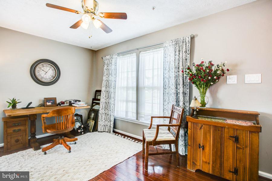 5036 Finsbury Road Baltimore, MD 21237 - Photo 4 of 34 a view of a livingroom with furniture and a window