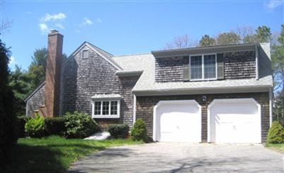 125 Shell Lane Cotuit, MA 02635 - Photo 3 of 12 a front view of a house with a yard