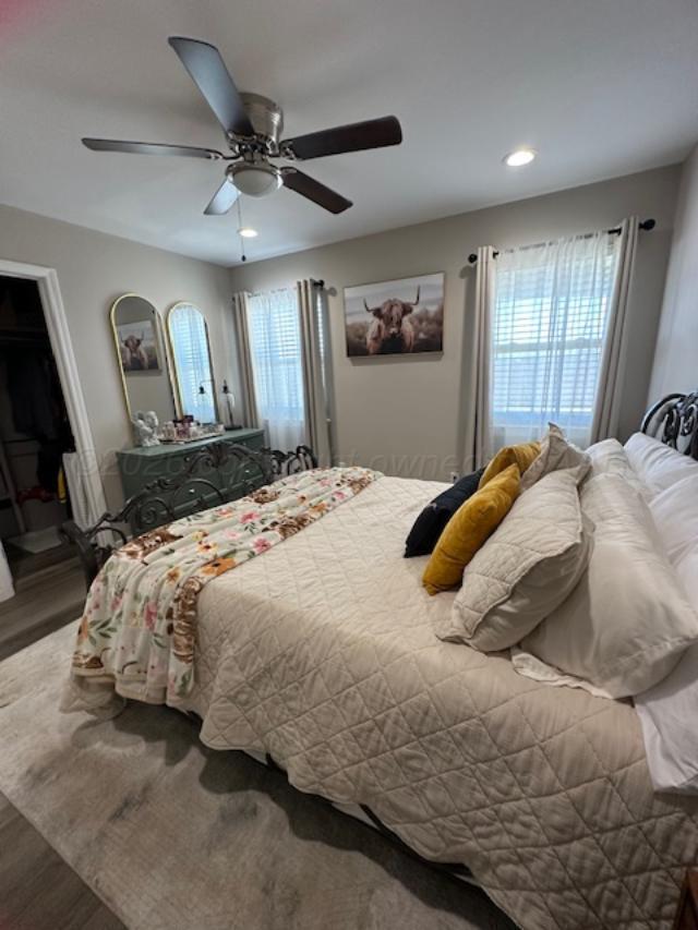 500 Poplar Dumas, TX 79029 - Photo 6 of 13 a bedroom with a large bed and a window
