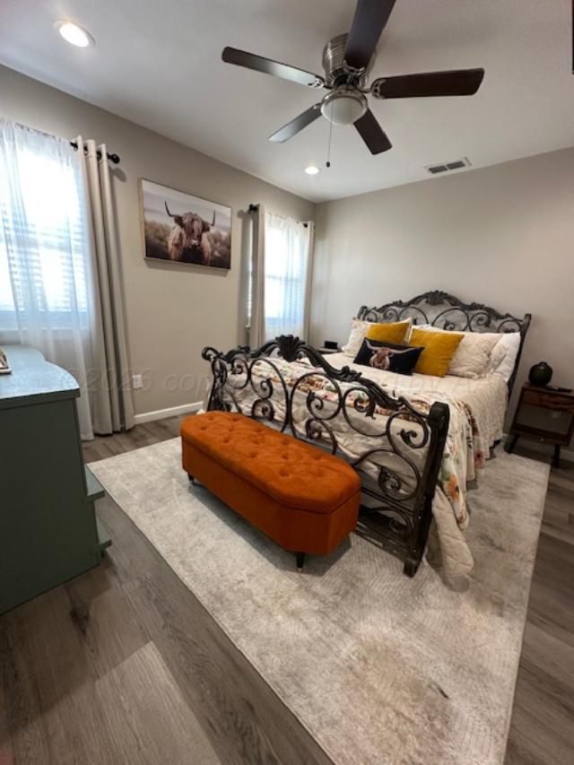 500 Poplar Dumas, TX 79029 - Photo 7 of 13 a bedroom with furniture and a chandelier
