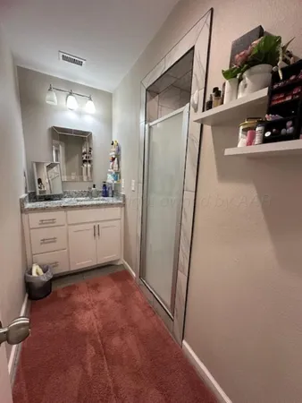 a kitchen with sink cabinets and refrigerator