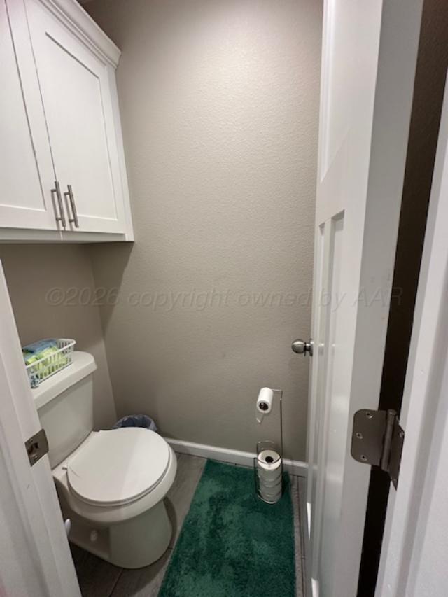 500 Poplar Dumas, TX 79029 - Photo 9 of 13 a bathroom with a toilet
