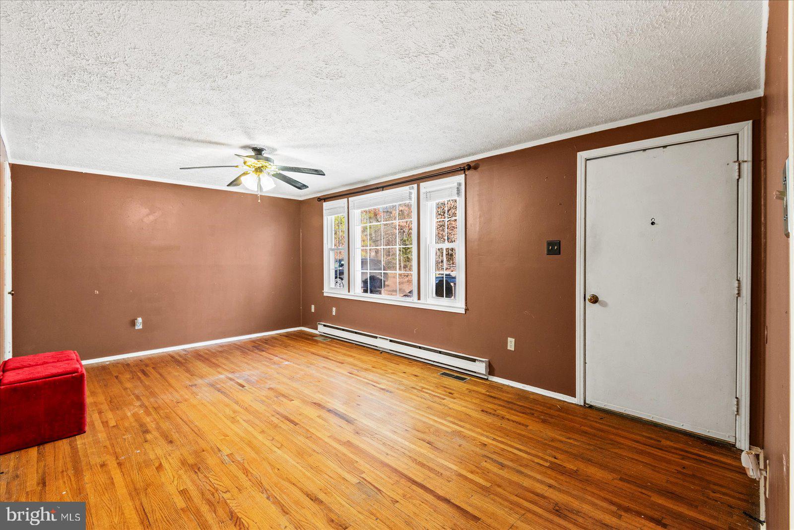 17035 Annfield Road Beaverdam, VA 23015 - Photo 3 of 28 a view of an empty room with window and wooden floor