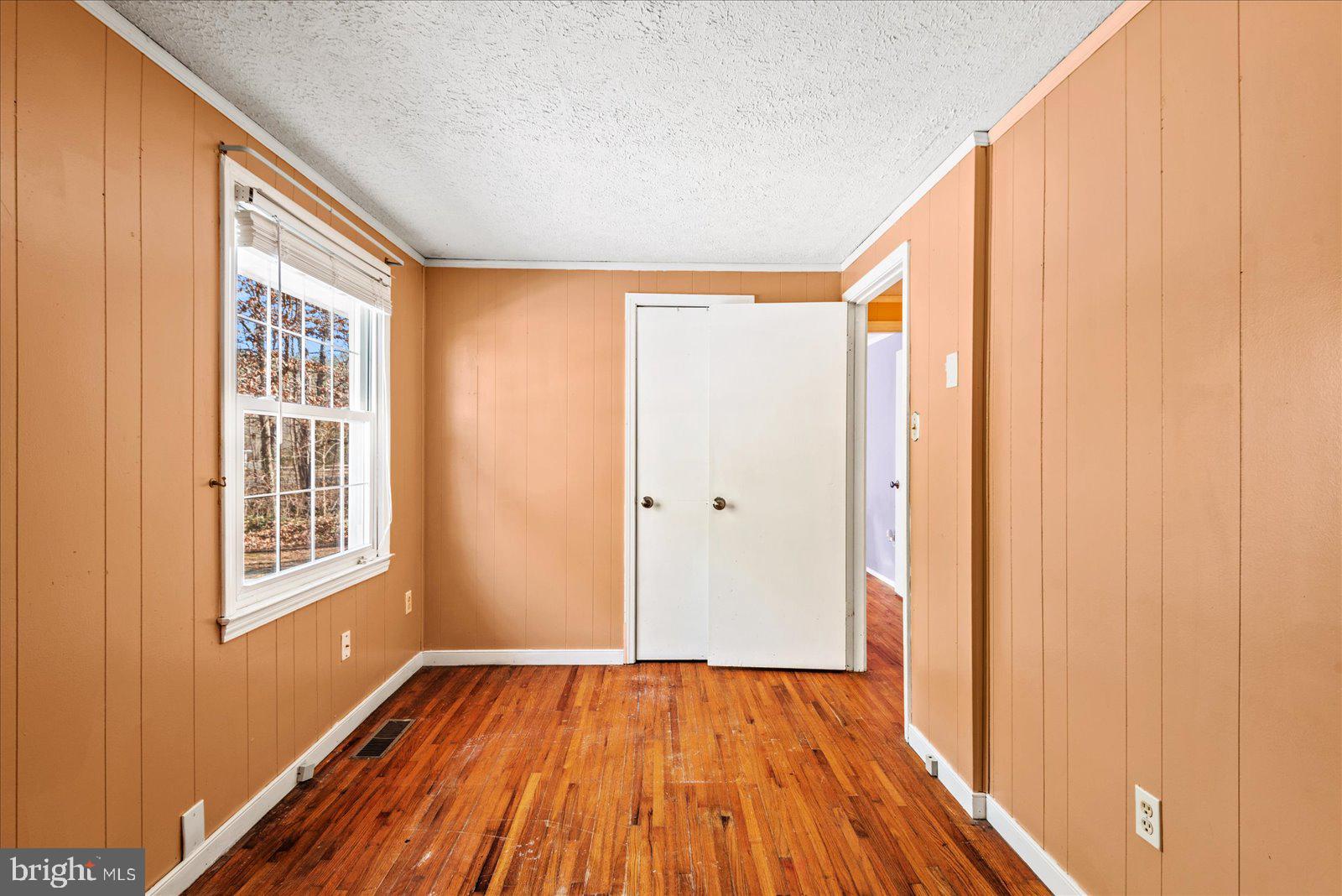 17035 Annfield Road Beaverdam, VA 23015 - Photo 8 of 28 a view of an empty room with wooden floor and a window