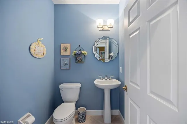 a bedroom with a bed chair and window