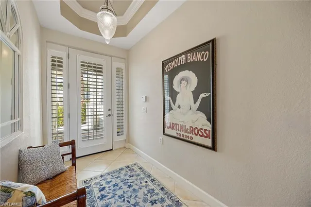 a room with furniture a desk and potted plants