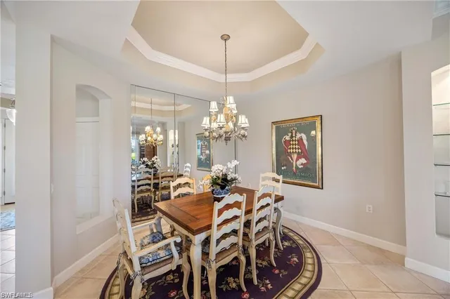a kitchen with cabinets stainless steel appliances and wooden floor
