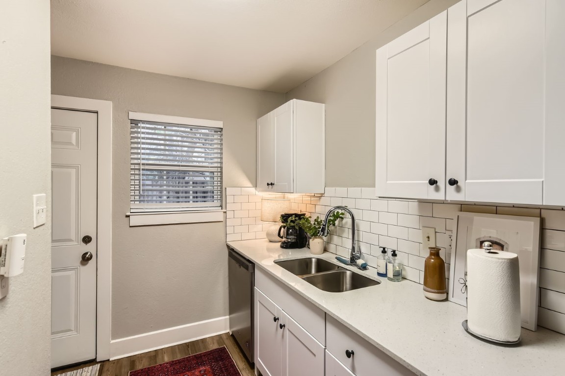6108 Calmar Cove, Unit B Austin, TX 78721 - Photo 13 of 21 a kitchen with a sink cabinets and window