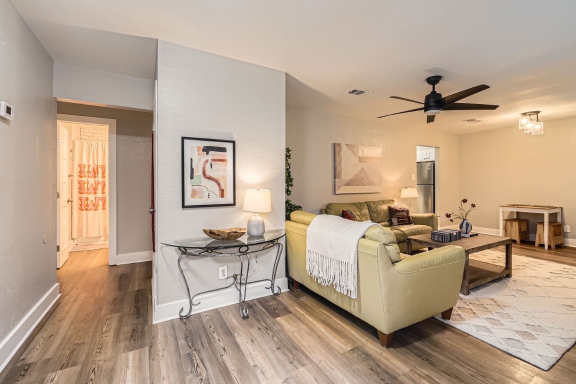 6108 Calmar Cove, Unit B Austin, TX 78721 - Photo 6 of 21 a living room with furniture and a large window