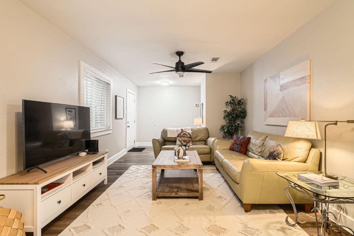 6108 Calmar Cove, Unit B Austin, TX 78721 - Photo 8 of 21 a living room with furniture and a flat screen tv