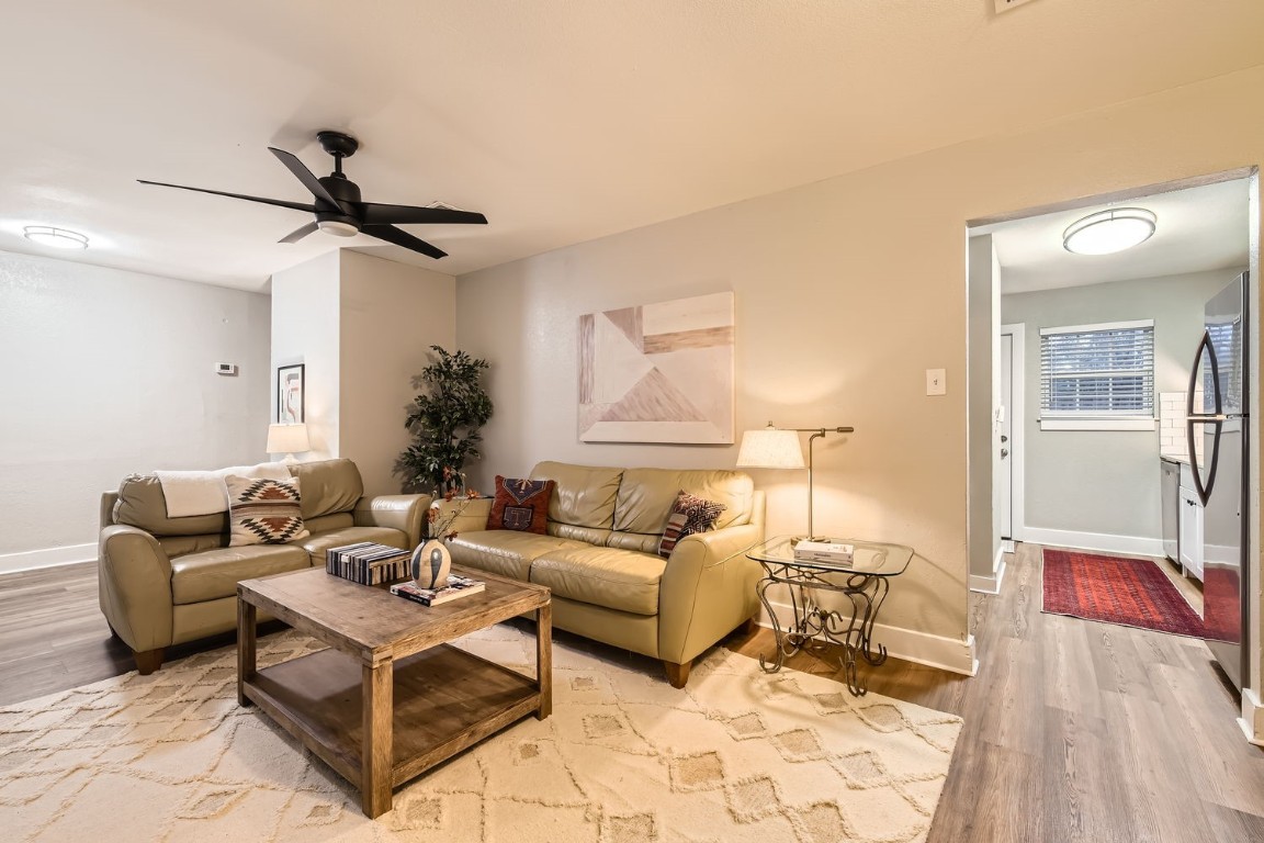 6108 Calmar Cove, Unit B Austin, TX 78721 - Photo 9 of 21 a living room with furniture and a lamp