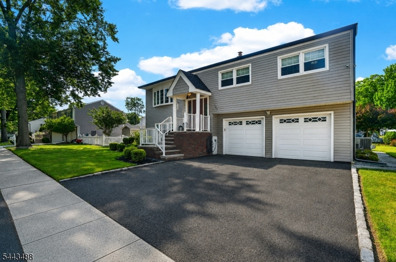 151 East Prospect Street Clark, NJ 07066 - Photo 29 of 31 a view of a house with a yard and garage