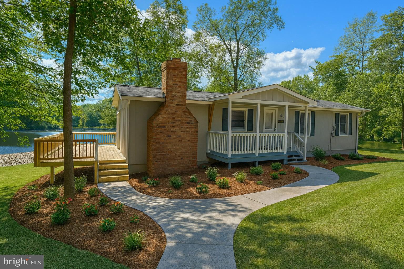 26374 Hill Road Ruther Glen, VA 22546 - Photo 1 of 31 a view of a backyard with plants and large tree