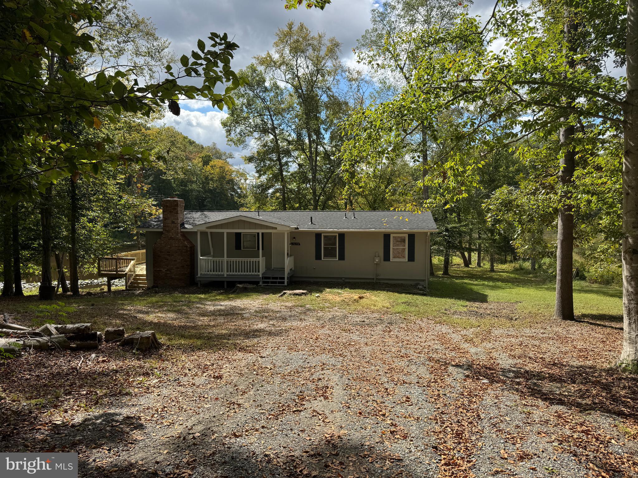 26374 Hill Road Ruther Glen, VA 22546 - Photo 27 of 31 a front view of a house with a garden