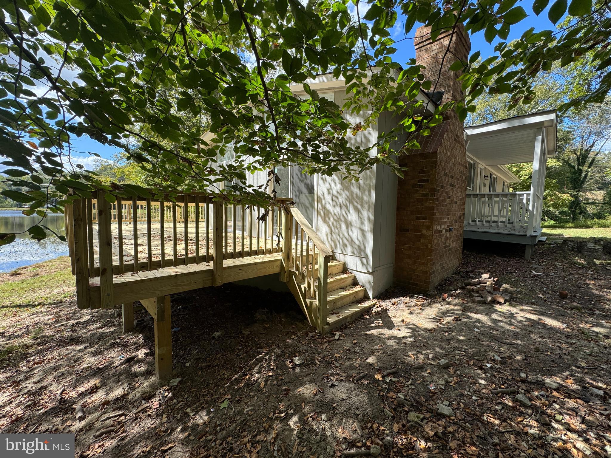 26374 Hill Road Ruther Glen, VA 22546 - Photo 28 of 31 a view of a yard with wooden fence and a tree