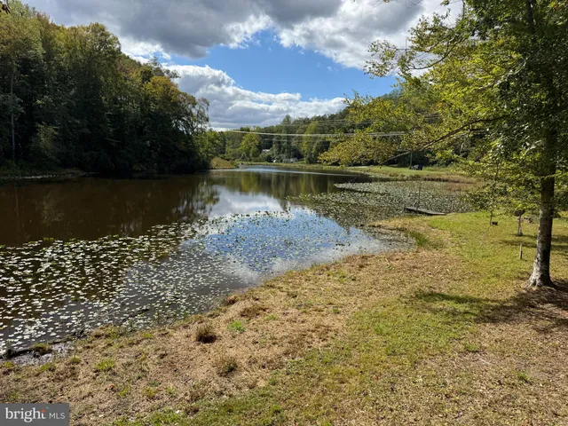 a view of a lake with a yard