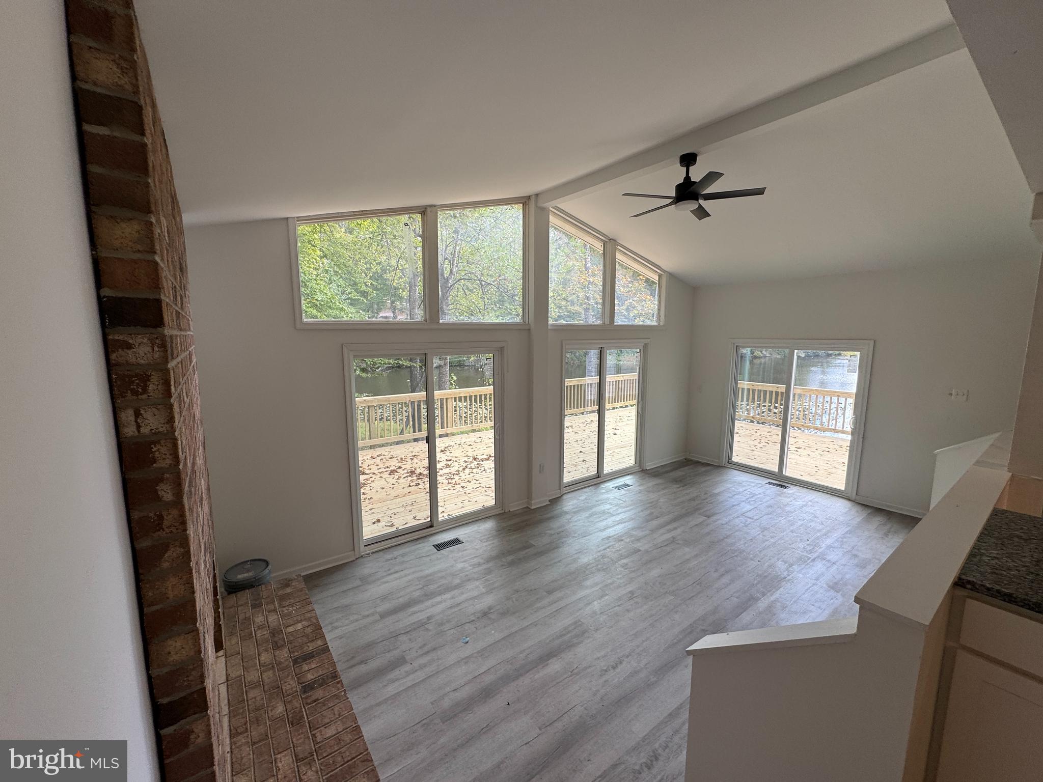 26374 Hill Road Ruther Glen, VA 22546 - Photo 6 of 31 wooden floor in an empty room with a window
