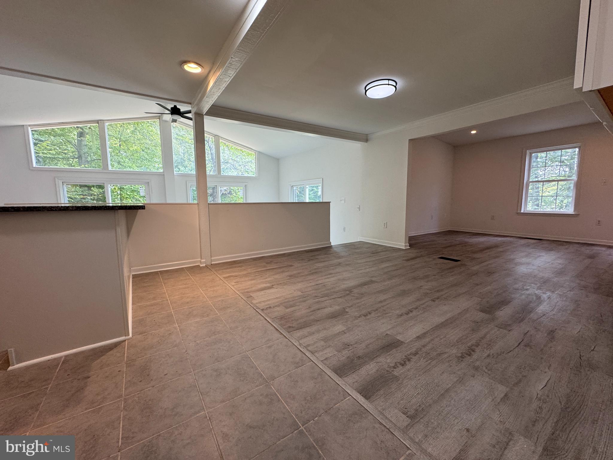 26374 Hill Road Ruther Glen, VA 22546 - Photo 7 of 31 a view of an empty room with wooden floor and a window