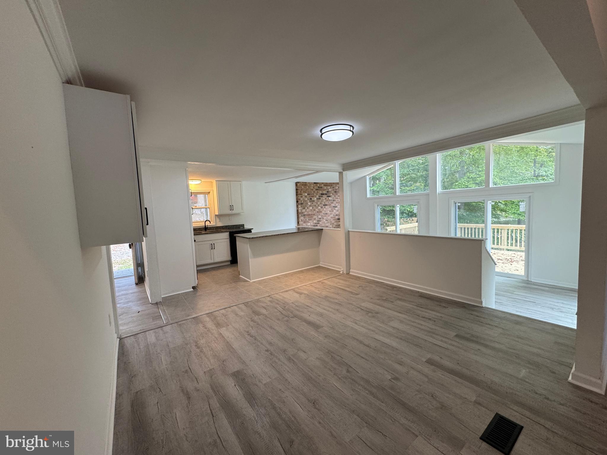 26374 Hill Road Ruther Glen, VA 22546 - Photo 8 of 31 a view of empty room with wooden floor and fan
