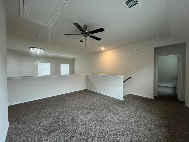 an empty room with a empty space and windows