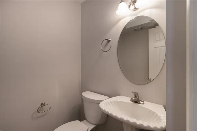 a bathroom with a sink and mirror