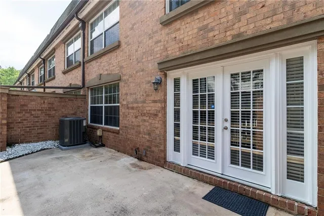 a view of a brick house with a large window