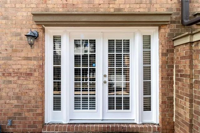 a front view of a house with a large window