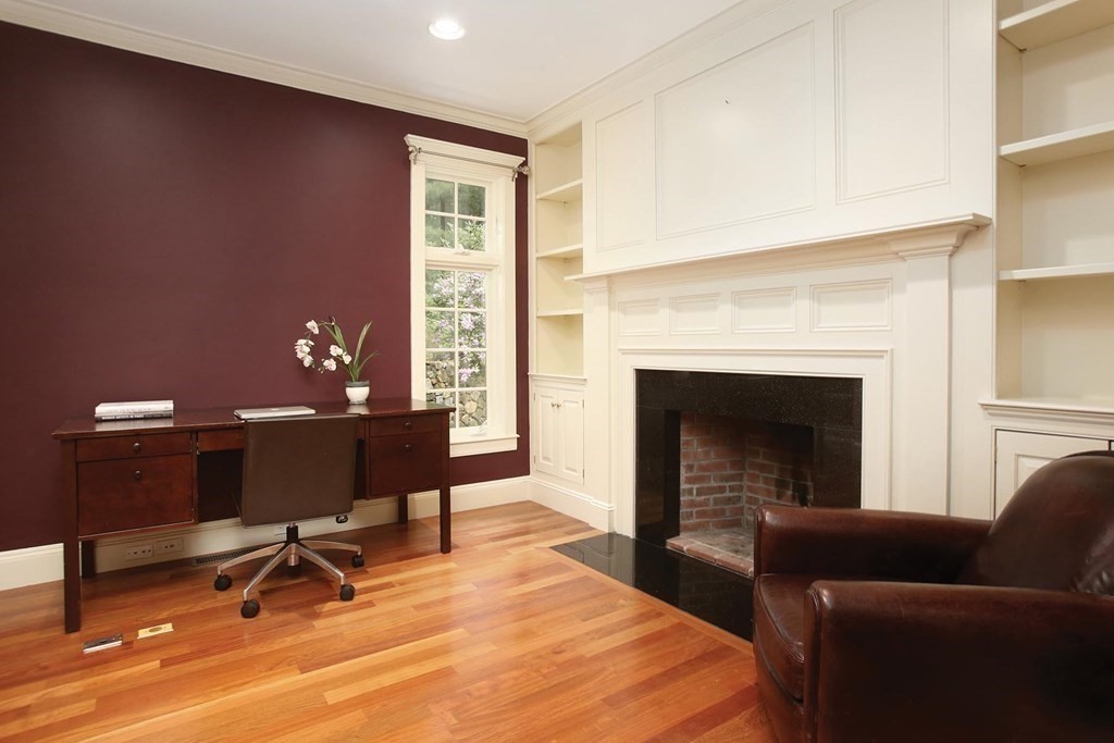10 Cutter's Bluff Weston, MA 02493 - Photo 14 of 34 a living room with furniture and a fireplace